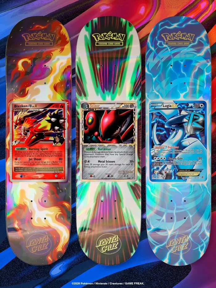 Three Santa Cruz x Pokémon TCG skateboard decks with fiery card-inspired backgrounds